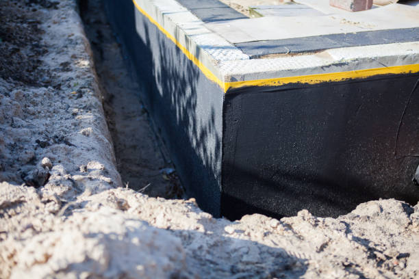 Professional Waterproofing technician working in Breedsville, MI